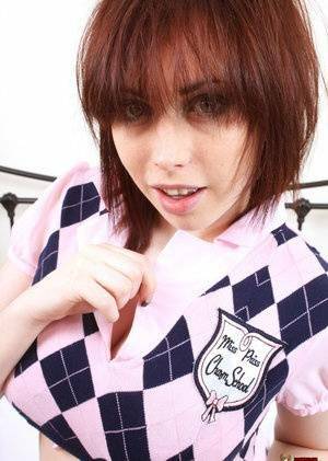 Louisa stripping off her schoolgirl uniform on ladyda.com