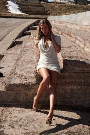 Hot blonde in white dress flashes pierced tits & naked pussy upskirt outdoors on ladyda.com