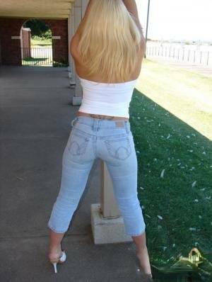 Blonde amateur Karen exposes her lace thong while outdoors in faded jeans on ladyda.com