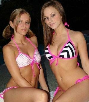 Young lesbians take off their bikinis in a safe for work manner at night on ladyda.com