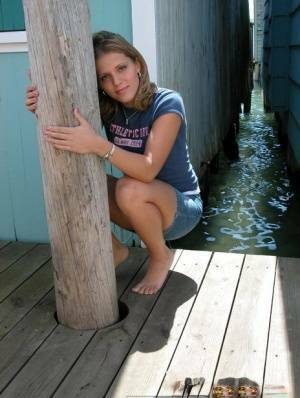 Blonde solo girl flashes upskirt panties on lakeside boardwalk on ladyda.com