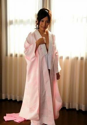 Japanese solo girl slips off her robe to reveal her nice boobs in white socks - Japan on ladyda.com