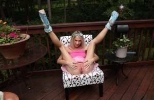 Thin blonde Sky Pierce attaches clamps to her wide open pussy on a deck on ladyda.com
