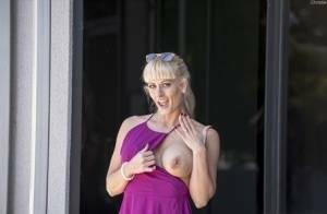 Naughty blonde flashes no panty upskirts and her big tits out in public on ladyda.com