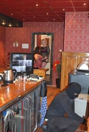 Amateur chick Kimberly Scott and a girlfriend disrobe a hooded male robber on ladyda.com