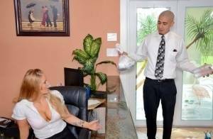 Clothed office worker unveiling big tits while fucking co-worker on ladyda.com