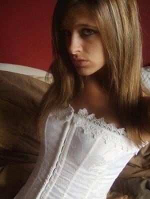 Teen in white corset and tight panties showing off her perfect tight body on ladyda.com
