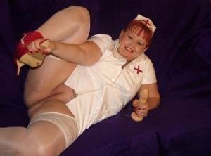 Mature redheaded nurse Valgasmic Exposed exposes herself during dildo play on ladyda.com
