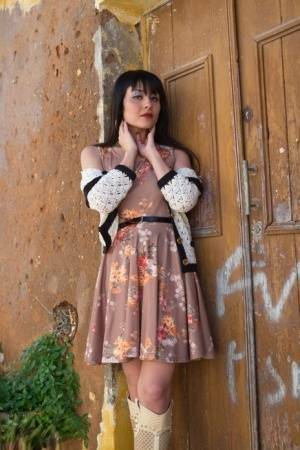 Asian model Sophia Jade flashes her upskirt panties on a cobblestone street on ladyda.com