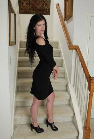 Clothed milf beauty Veronica Stewart is taking off her black dress on ladyda.com