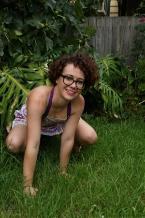 Geeky girl Rosie wears her glasses for her nude debut on the back lawn on ladyda.com