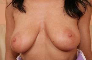 European babe freeing big MILF tits from uniform before masturbating on ladyda.com