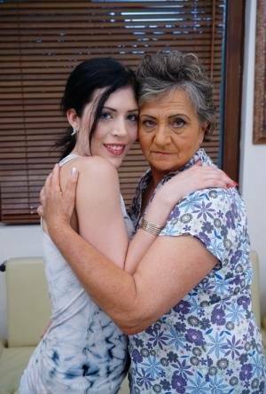 Lesbian granny worshipping sexy teen's attractive body and holes on ladyda.com