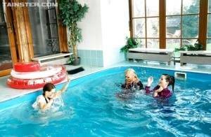 Playful fetish ladies have some fully clothed fun in the pool on ladyda.com