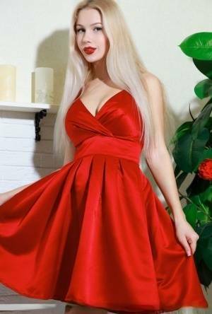 Nice blonde teen Genevieve Gandi removes red dress to display her trimmed muff on ladyda.com