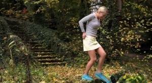 Cute blonde Victoria Pure hikes her skirt to take a pee along country lane on ladyda.com