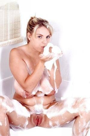 Plump Euro babe Kelly Kay soaps up huge pornstar juggs in bathtub on ladyda.com