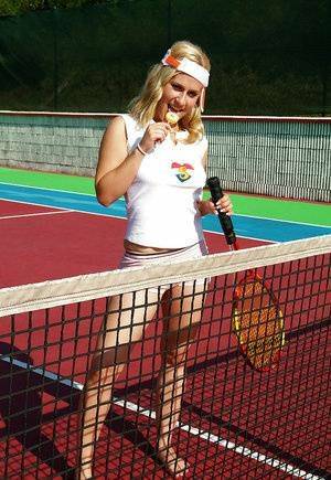 Sporty babe with big tits Angel B toying her cunt on the tennis court on ladyda.com