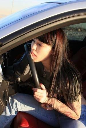 Amateur girl Susy Rocks flips the bird while exposing her big tits in a car on ladyda.com