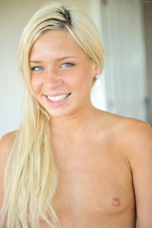 Sweet blonde teen plays with her labia lips before self fisting her pussy on ladyda.com