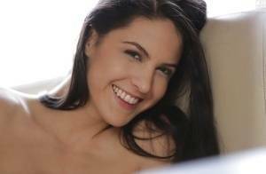 Latina pornstar Carolina Abril strips off her white bra and panties on ladyda.com