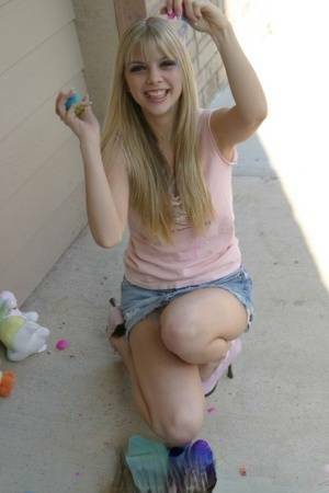 Sweet blonde teen Jana Jordan flashes upskirt panties while eating chocolate - Jordan on ladyda.com