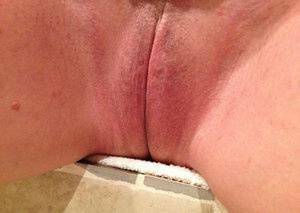 Older amateur Busty Bliss finger spreads her pink vagina after showering on ladyda.com