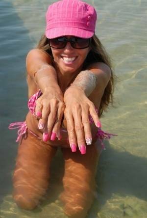 Amateur model Lori Anderson shows her hairy arms while wearing a bikini on ladyda.com