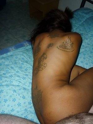 Tattooed Thai girl Nit getting banged bareback on bed by sex tourist - Thailand on ladyda.com