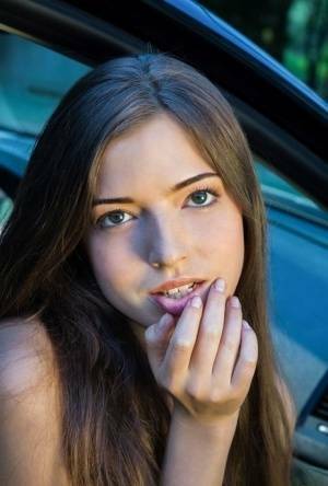 Beautiful teen girl models in the nude on passenger seat of car with door open on ladyda.com