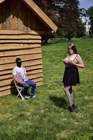 Natural redhead masturbates on a lawn before teasing a masked man on ladyda.com