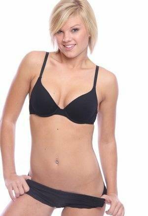 Blonde amateur Tiffany models in her black bra and panty set on ladyda.com
