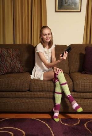 Adorable teen Alicia Williams takes a selfie before getting naked in OTK socks on ladyda.com