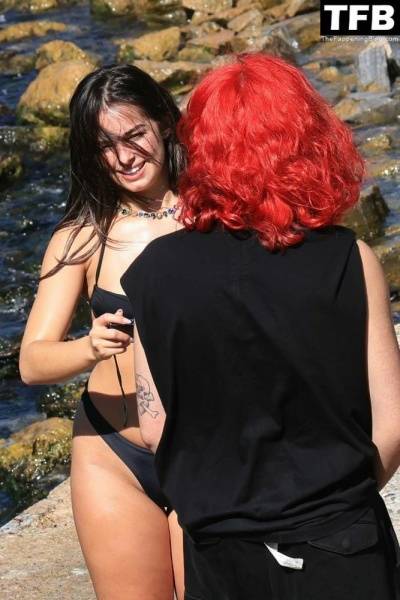 Addison Rae Displays Her Curves in a Black Bikini on Holiday with Omer Fedi on Lake Como on ladyda.com