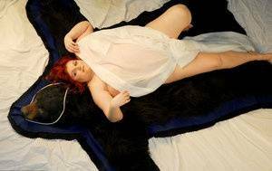 Fat redhead Black Widow AK models totally naked on a bearskin rug on ladyda.com