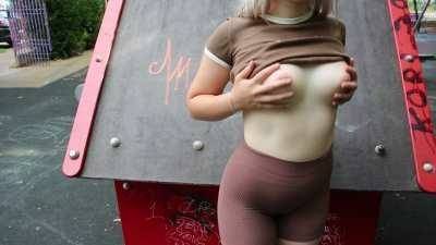 Public flashing in a park with people around on ladyda.com